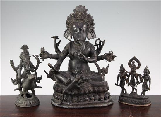 Three bronze Hindu groups, 16cm -32cm high